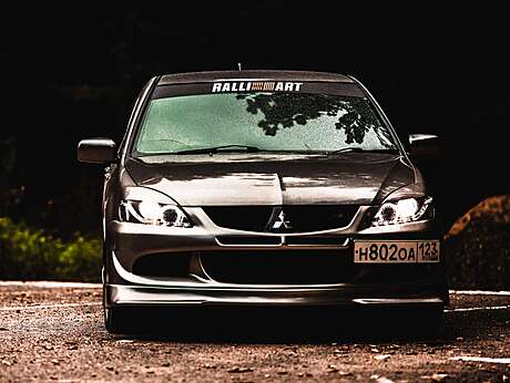 Юбка переднего бампера MV-Tuning в стиле EVO под покраску для Mitsubishi Lancer IX 2003-2009