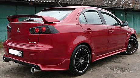 Юбка заднего бампера Zodiak var№2 под раздвоенный выхлоп MV-Tuning для Mitsubishi Lancer X 2007-2016